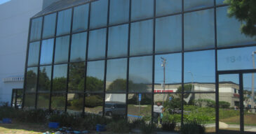 This is how performance glass, or exterior reflective glass, looks when neglected for years. Huntington Beach, CA