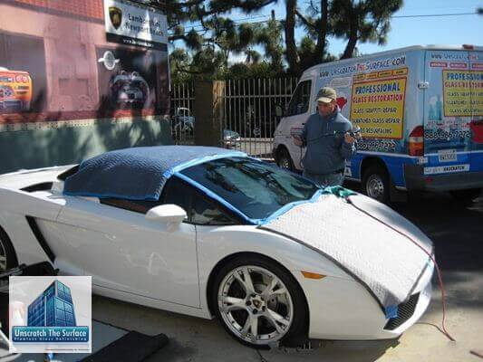 Polishing windshield scratches on Lamborghini 